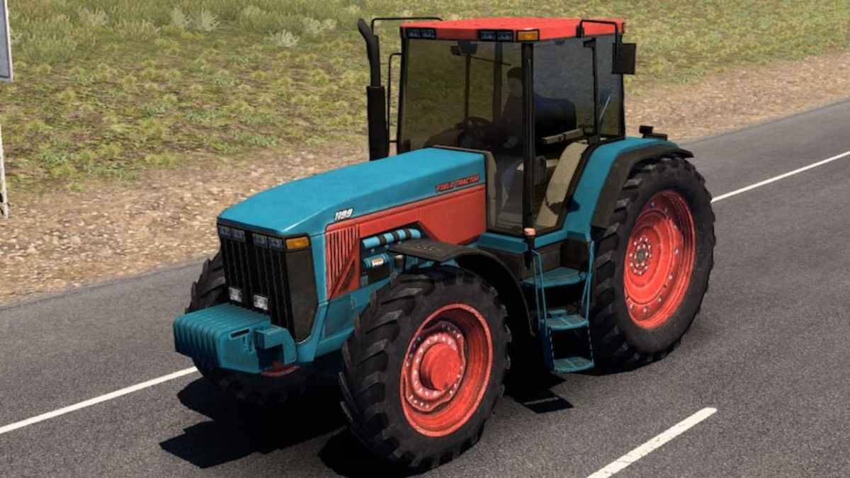 Ein Traktor, der in den amerikanischen LKW -Simulator modisch modisch war und eine Straße hinunterfährt.